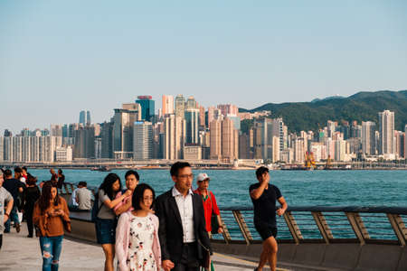 HongKong, China - November, 2019: People at Tsim Sha Tsui Promenade (Avenue of the Stars) at Victoria Harbor in Hong Kongのeditorial素材