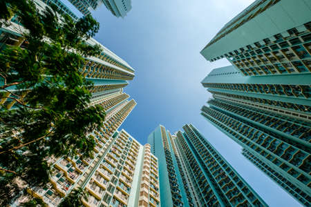 looking up on high-rise apartment building, residential building facade, hongkongの写真素材