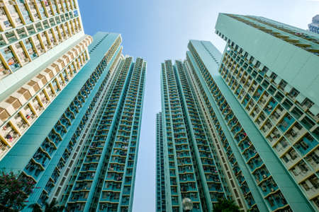 looking up on high-rise apartment building, residential building facade, hongkongの写真素材