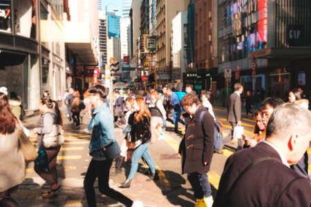 HongKong, China - November, 2019: Blurry image of unrecognizable people crossing street in Hong Kong