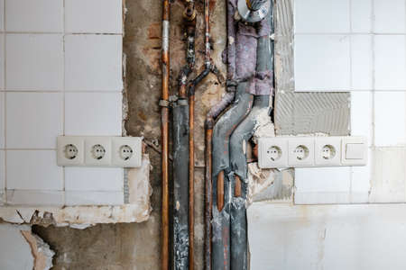 old water pipes and tubes during renovationの写真素材
