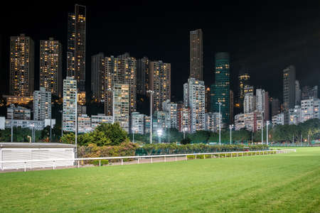 Empty race track and skyline background, Horse racing course in Hong Kong Jockey Club, Happy Valleyのeditorial素材