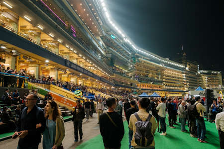 Hong Kong, November, 2019: People at horse racing course in Hong Kong Jockey Club, Happy Valleyのeditorial素材