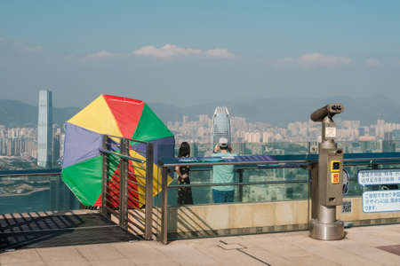 HongKong, China - November, 2019: People looking on skyline of HongKong from The Peak observation deck on Peak Tower, the most popular landmark in Hong Kongのeditorial素材