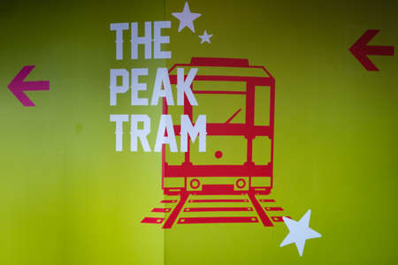 HongKong - November, 2019: Sign showing direction to the Peak Tram train station at Garden Road in Hong Kong. The train carries tourists to Victoria Peak for a skyline view over HongKongのeditorial素材