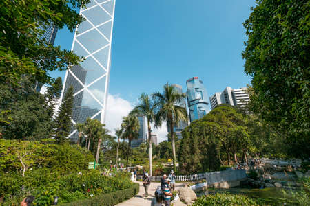HongKong - November 18, 2019: The Hong Kong Park with lake and skyscrapers buildings in background in HongKong business districtのeditorial素材
