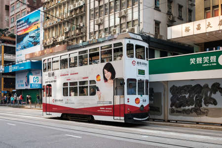 Hong Kong - November, 2019: Famous historic double-decker tram car on the street of Hong Kong Islandのeditorial素材