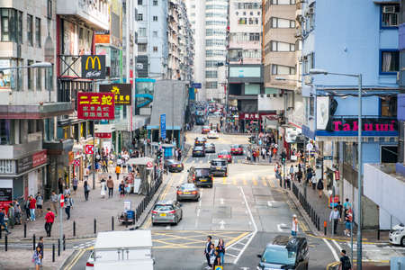 Hong Kong - November, 2019: Street traffic, cars and people in Hong Kong Cityのeditorial素材