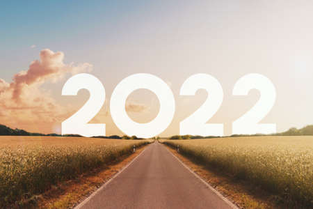 straight road heading to happy new year 2022の写真素材