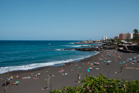Tenerife, Spain - September, 2021: People at beach in Puerto de la Cruz, Tenerifeのeditorial素材