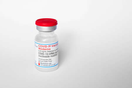 Berlin, Germany - February, 2022: Covid-19 mRNA Vaccine bottles by Moderna