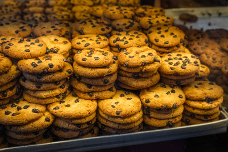 Pile of chocolate cookies in bakery displayの写真素材