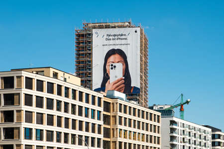 Berlin, Germany -June, 2022: Apple Iphone advertisement on billboard on building facadeのeditorial素材