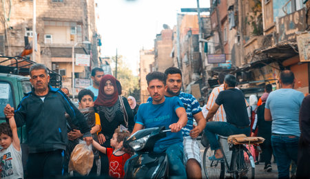 Damascus, Syria - May, 2022: People on street in city traffic in Damascus, Syriaのeditorial素材