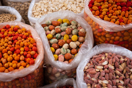Bags of nuts for sale, snacks on food marketの写真素材