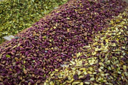Piles of pistachio nuts for sale on food marketの写真素材
