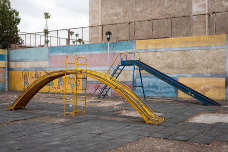 run down slide on old playground, Damascus, Syria ,の写真素材