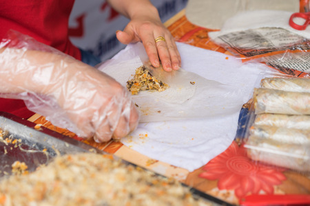 Making Vietnamese traditional spring rolls by hands