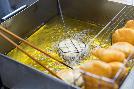 Goi cake is frying on home-made square pan on Hanoi streetの写真素材
