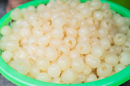 Basket of processed longan fruit with skin removedの写真素材