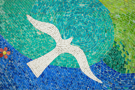 Porcelain pieces mosaic background. Bird shape