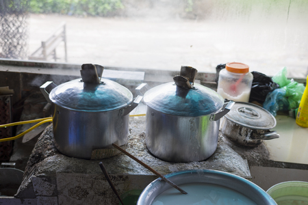 Steaming pot to make Vietnamese Rice noodle roll (banh cuon)の写真素材