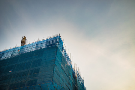 Under construction apartment building with vignette effect addedの写真素材