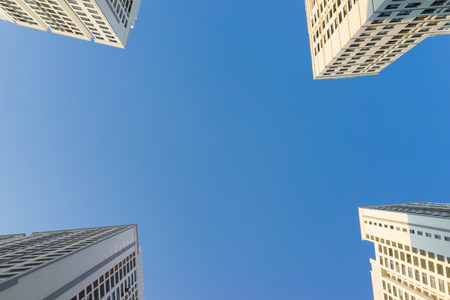 Resident apartment buildings against blue sky. Real estate background