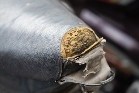 Torn motorbike saddleの写真素材