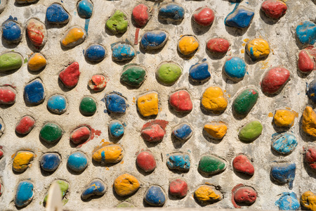Colorful pebbles on wall backgroundの写真素材