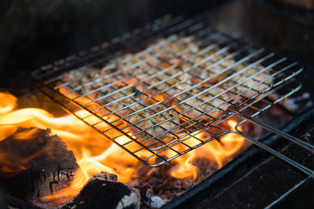Barbecue meat on coal fire. The ingredient of bun cha is the famous Vietnamese noodle soup with bbq...