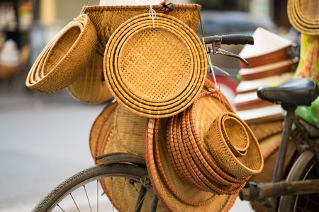 Vietnamese traditional bamboo baskets on vendor bike in Hanoi streetの写真素材