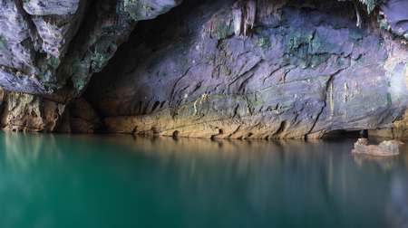 River and rock cliff inside of Phong Nha Cave in Phong Nha-Ke Bang National Park, Quang Binh Province, Vietnamの写真素材