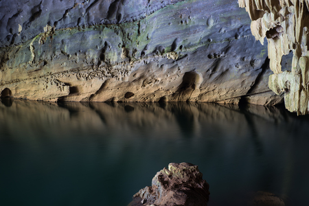 River and rock cliff inside of Phong Nha Cave in Phong Nha-Ke Bang National Park, a UNESCO World Heritage Site in Quang Binh Province, Vietnamの写真素材