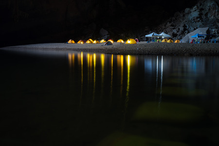 Campsite in Hang En (swallow cave), the entrance to Son Doong Cave, the largest cave in the world, is in the heart of the Phong Nha Ke Bang National Park in the Quang Binh province of Central Vietnamの写真素材