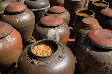 Jars of processing soybean jam made by traditional outdoor way under natural sunlightの写真素材