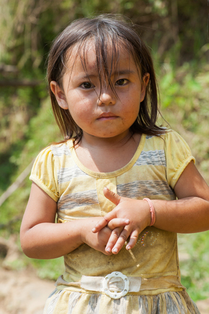 Ha Giang, Vietnam - Sep 22, 2013: Portrait of Hmong little girl child in front of her houseのeditorial素材