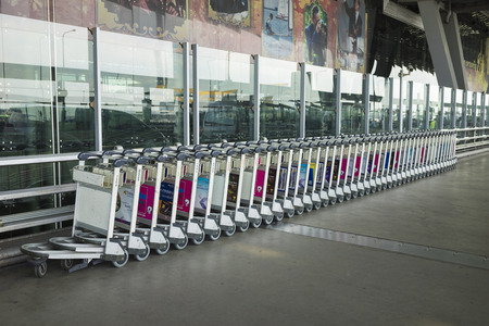 Bangkok, Thailand - June 28, 2015: Stacked empty trolleys in Suvarnabhumi Airportのeditorial素材