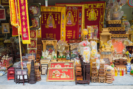 Hanoi, Vietnam - Nov 1, 2015: Worshiping objects for sale on Hanoi street: funeral flag, altar, flower lantern...Offerings in Oriental cultureのeditorial素材