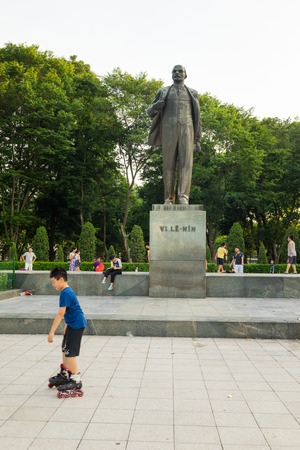 Hanoi, Vietnam - July 10, 2016: Vladimir Ilyich Lenin statue, with children playing game in Lenin park, Dien Bien Phu streetのeditorial素材
