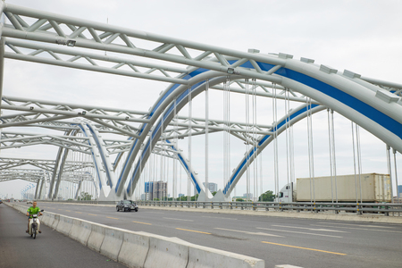 Hanoi, Vietnam - Aug 30, 2015: The Dong Tru arch bridge, made of steel tubes filled with cement, was opened for safety testing in Hanoi on October 2014 as part of the extended Highway No. 5 projectのeditorial素材