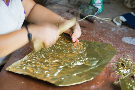 Bac Ninh, Vietnam - Sep 12, 2015: Copper handicraft products are makeing by junior craftsmen in traditional way (hand work) in Dai Bai village. Junior people are major labors in traditional works in Vietnamのeditorial素材