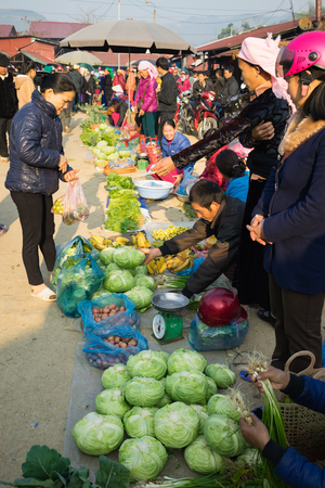Ha Giang, Vietnam - Feb 14, 2016: Rural local market in Dong Van district, Ha Giang. The trading goods are almost homemade things like vegetable, meat, agricultural tooling...のeditorial素材