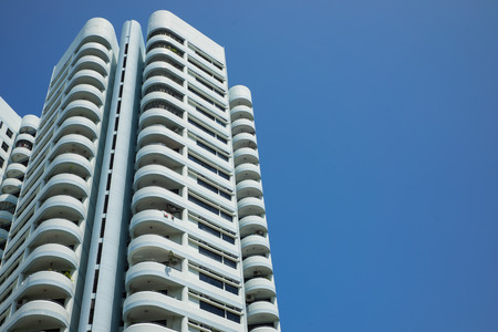 Modern apartment building in Singapore with blue sky