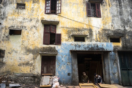 Old color damaged architectural house wall in Hanoi capital, Vietnamの写真素材