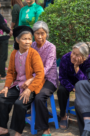 Hanoi, Vietnam - Jun 22, 2017: Vietnamese elderly people at folk village festival in communal house at So village, Quoc Oai district.のeditorial素材