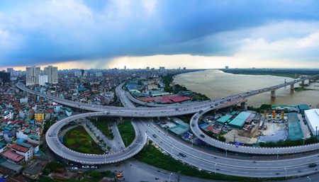 Hanoi, Vietnam - June 5, 2017: Aerial view of Hanoi cityscape by twilight period, with road junction and interchange overpass Vinh Tuy bridge - Minh Khai street - Nguyen Khoai streetのeditorial素材