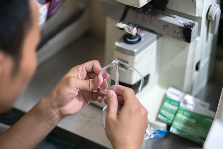 Eye glasses is making by drilling machine in workshopの写真素材