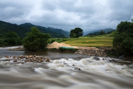 River stream in flood after several days of rain in north Vietnam
