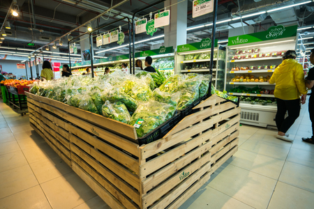 Hanoi, Vietnam - July 10, 2017: Organic vegetables on shelf in Vinmart supermarket, Minh Khai street. Vineco brand vegetable.のeditorial素材